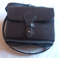 Brown leather Binocular Case with shoulder strap and nickle Sam Brown fastening.
